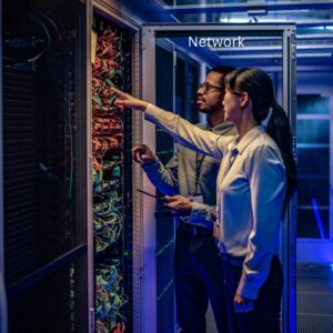 Two people inspecting server, network scanning operations security